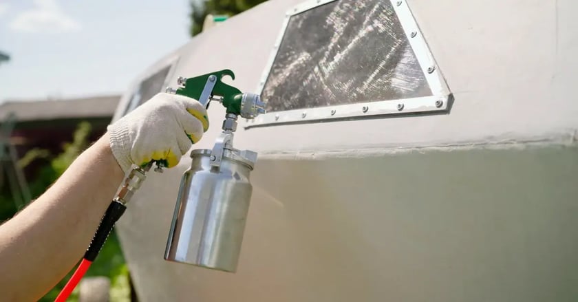 Spray painting the details of a boat