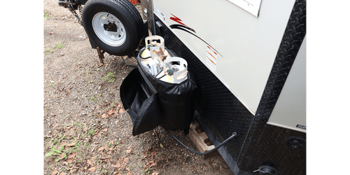 A Propane Tank Warmer with Lid (PTW-302-L) attached to an Ice House