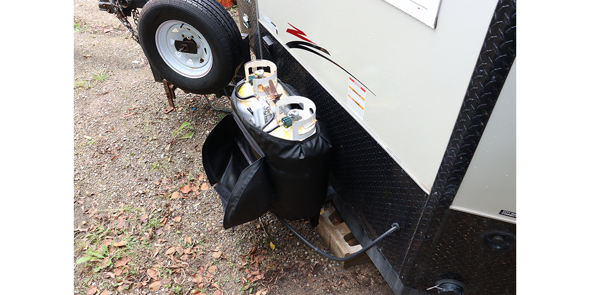 A Propane Tank Warmer with Lid (PTW-302-L) attached to an Ice House