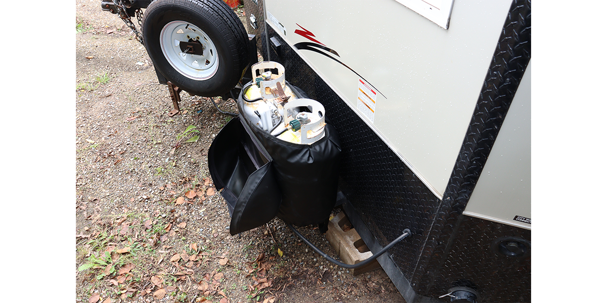 A Propane Tank Warmer with Lid (PTW-302-L) attached to an Ice House