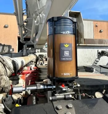 Refillable Grease Pump on Concrete Truck