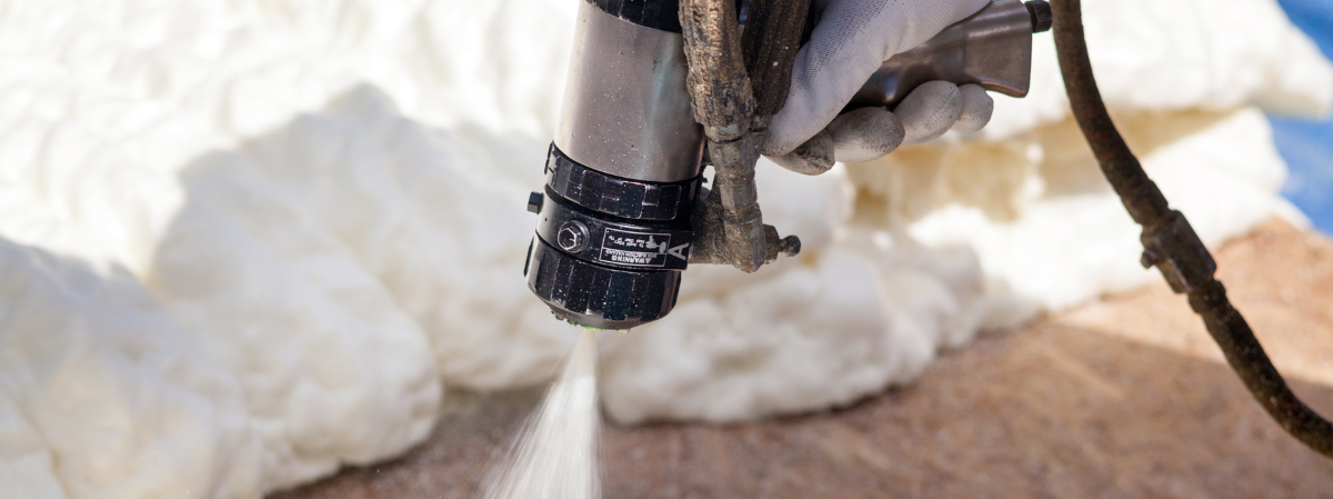 Spraying spray foam on a job-1