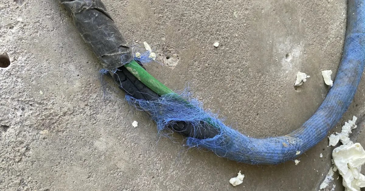 Damaged concrete hose in concrete raising