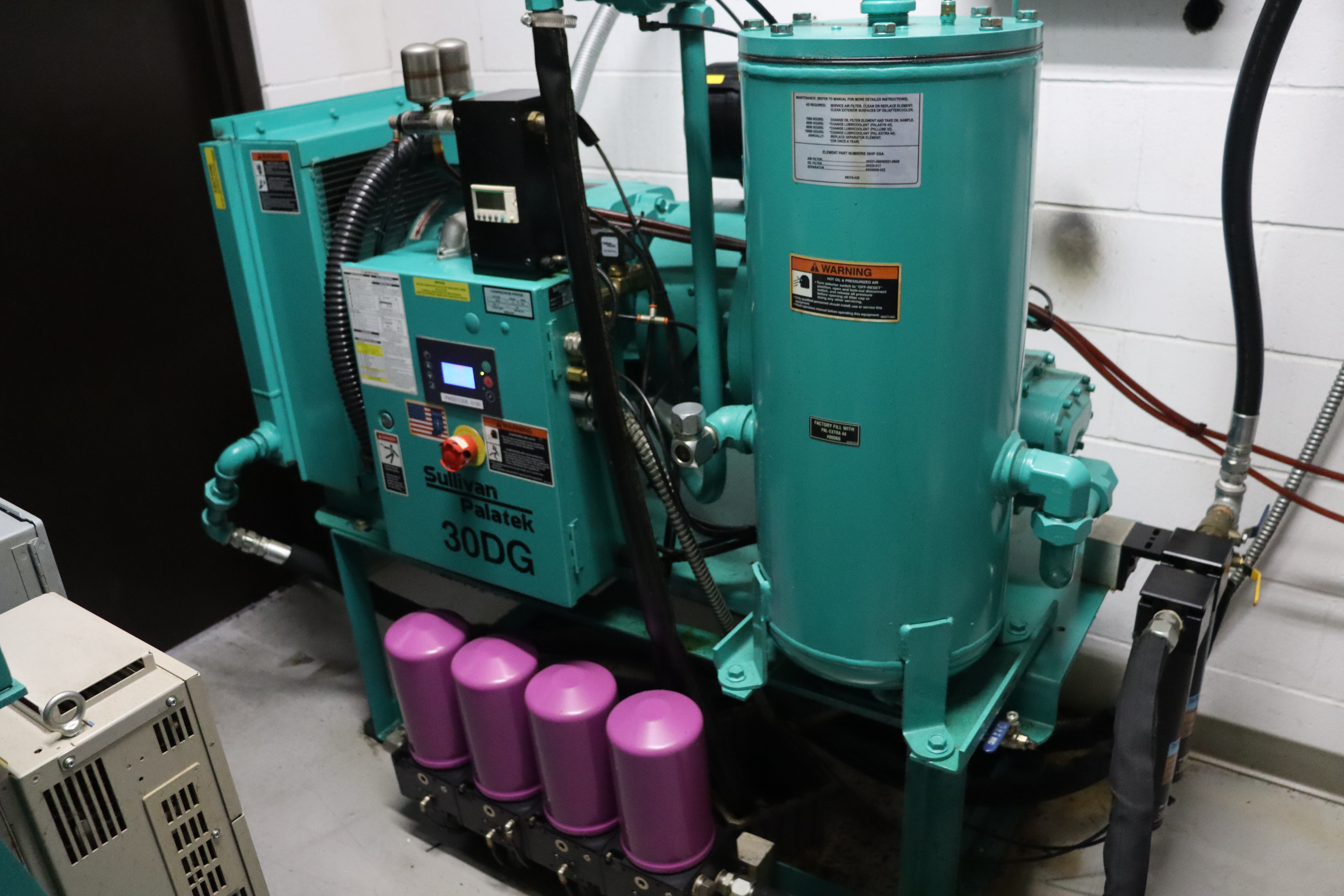 tsunami sullivan palatek 30DG compressor with tsunami purple dessicant dryers on shop floor